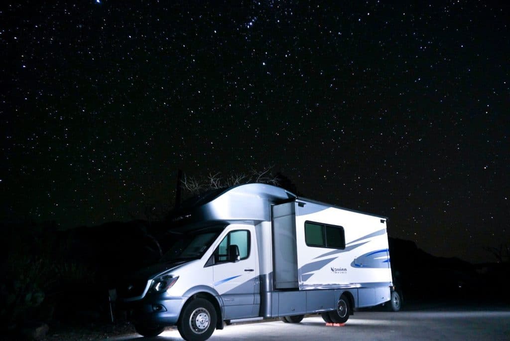 RV under the night sky with stars in Chisos basin campground Big Bend National park