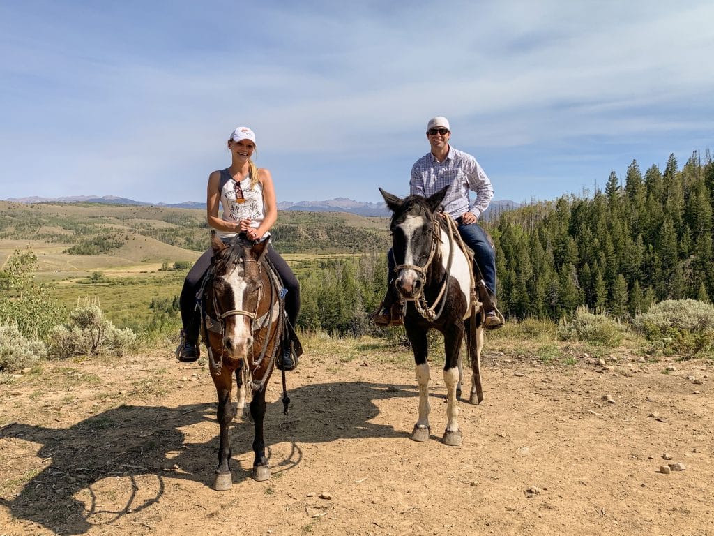 Couple Horseback riding in Granby, Colorado