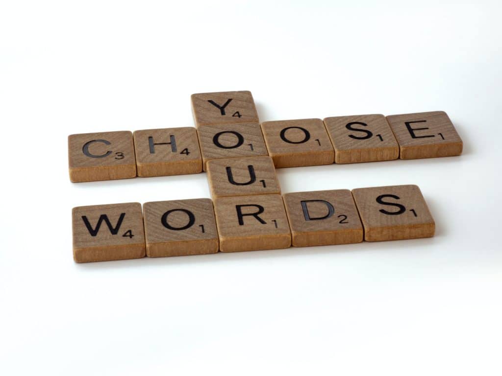 Scrabble tiles formed to say choose your words